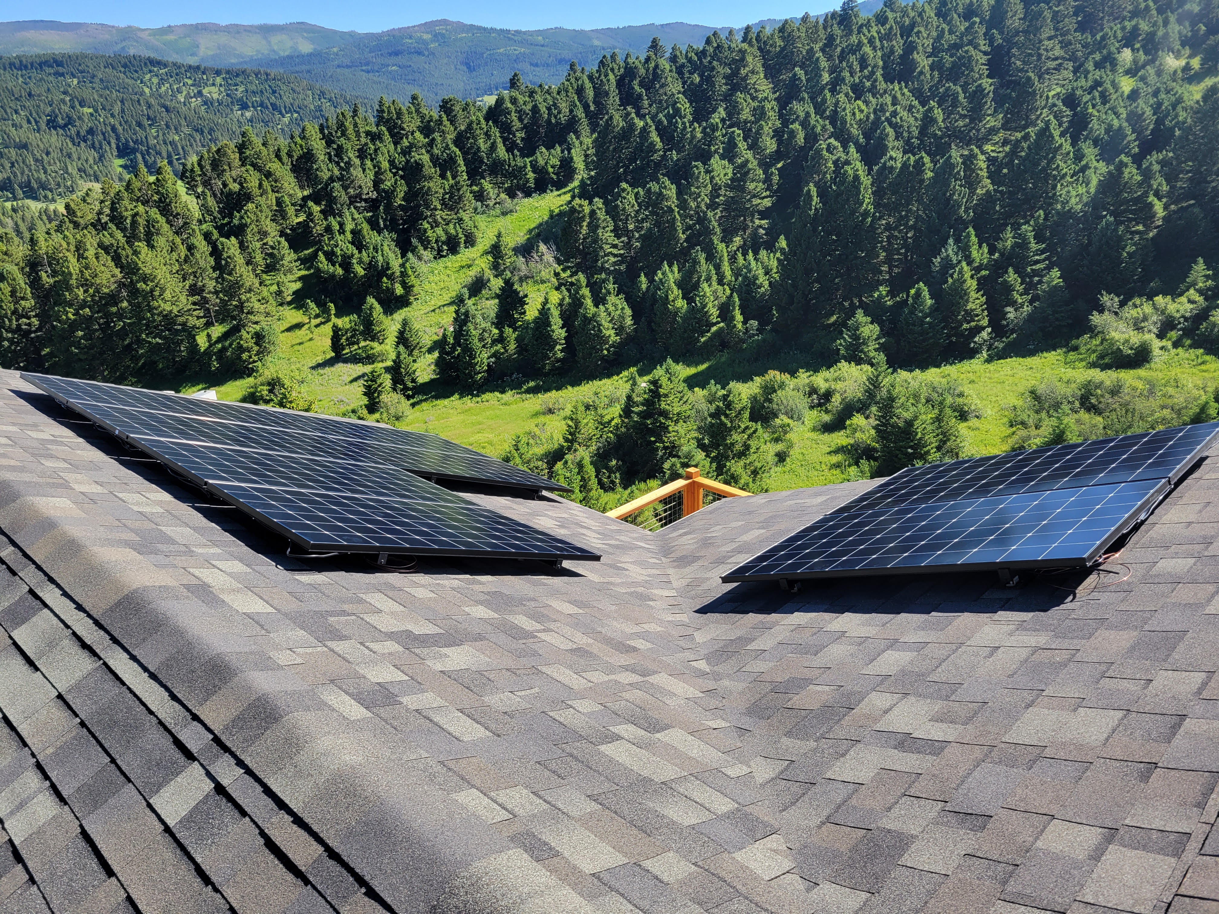 Solar Panels installed on roof overlooking mountains